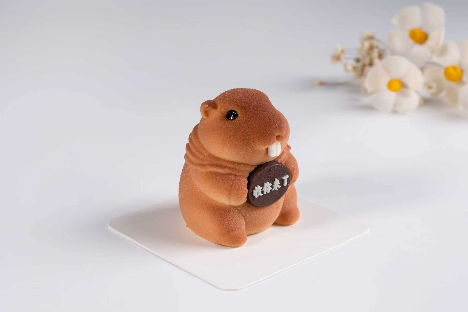 Groundhog-formet mousse kage